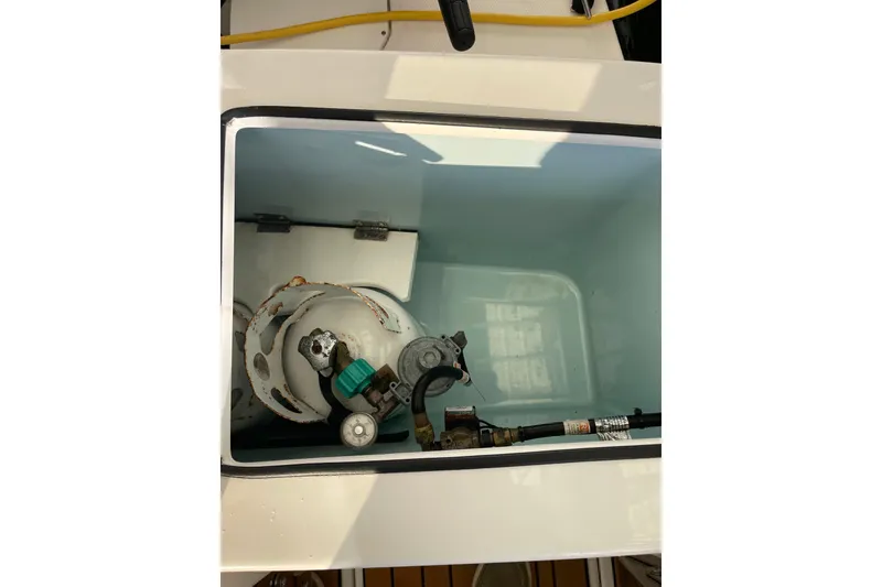 Slide: The Image of Propane tank compartment on a 2019 Ranger Tugs R-27 boat. - 14