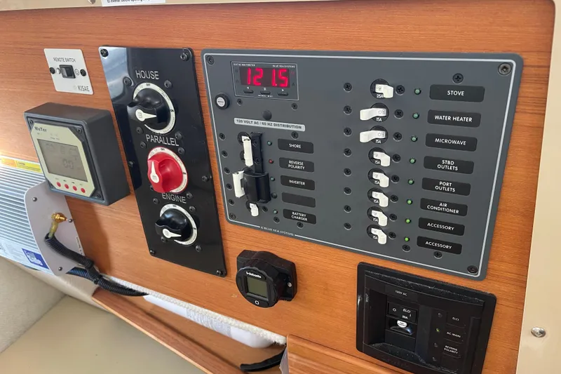 Slide: The Image of Control panel of a 2019 Ranger Tugs R-27 boat with switches and meters. - 16