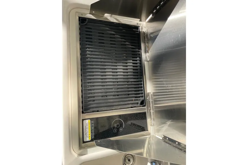 Slide: The Image of Built-in grill on 2019 Ranger Tugs R-27 boat, featuring sleek stainless steel design. - 17