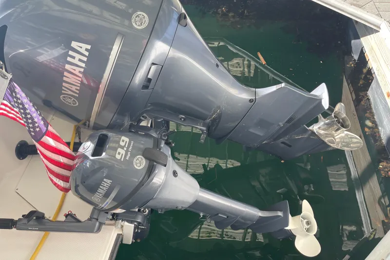 Slide: The Image of Yamaha outboard motors on 2019 Ranger Tugs R-27, docked with American flag. - 3
