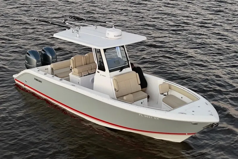 Slide: The Image of 2021 Pursuit S 268 Sport boat on water, featuring dual engines and sleek design. - 2