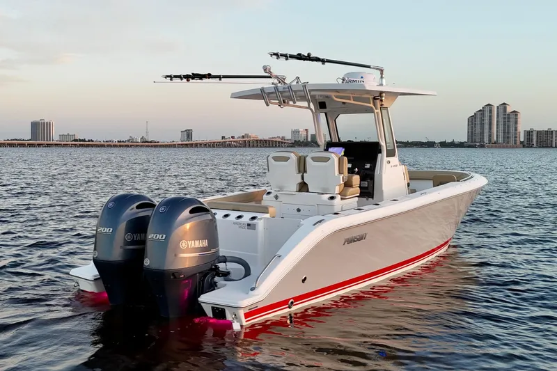 Slide: The Image of 2021 Pursuit S 268 Sport boat with twin Yamaha engines on calm water. - 4