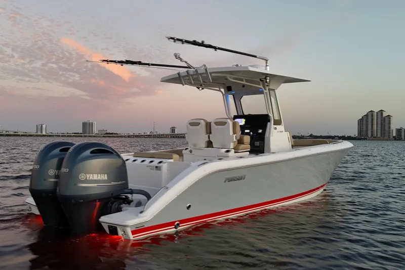 Slide: The Image of 2021 Pursuit S 268 Sport boat on water at sunset with Yamaha engines. - 6