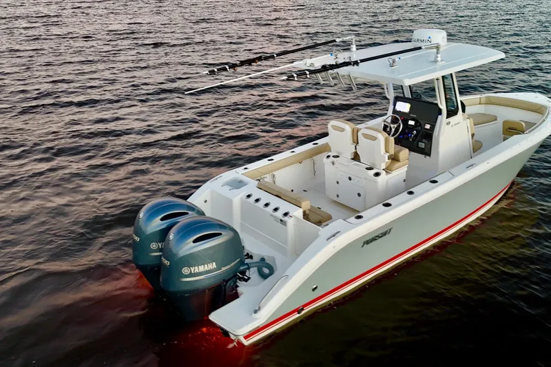 Slide: The Image of 2021 Pursuit S 268 Sport boat with dual Yamaha engines on open water. - 8