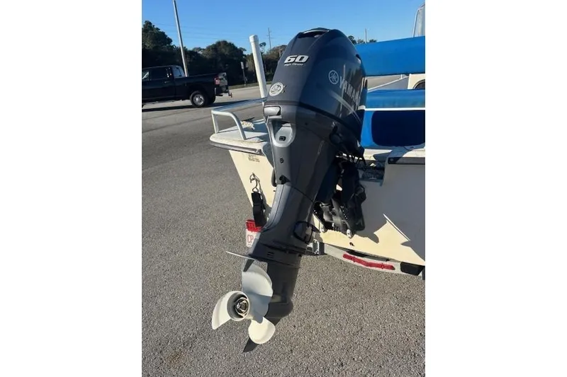 Slide: The Image of 2004 Carolina Skiff 17DLX with Yamaha 60HP outboard motor on trailer. - 5