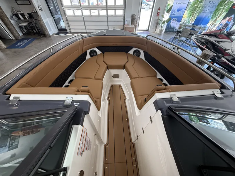 Slide: The Image of Interior of 2026 Chaparral GTS 6 boat with brown leather seating. - 10