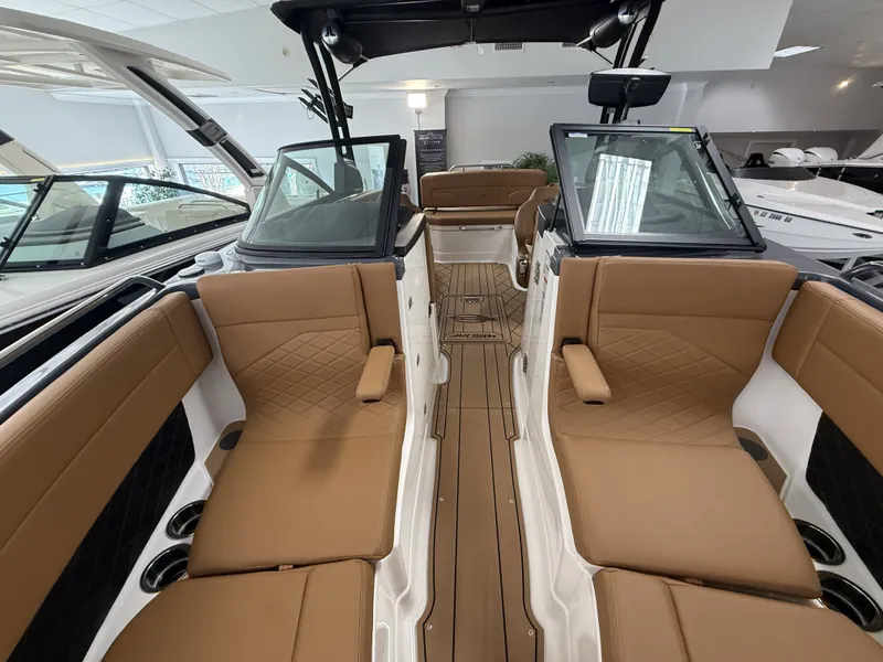 Slide: The Image of Interior of 2026 Chaparral GTS 6 boat with brown leather seats. - 12