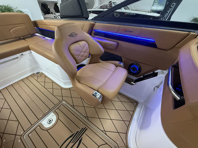 Slide: The Image of 2026 Chaparral GTS 6 interior with luxurious seating and blue ambient lighting. - 15