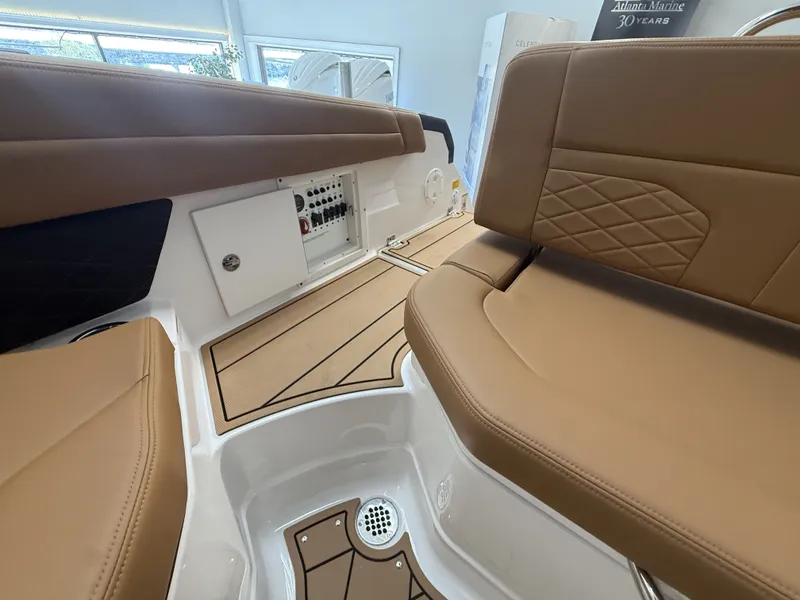 Slide: The Image of Interior of Chaparral GTS 6 boat, 2026 model, featuring brown leather seats. - 5