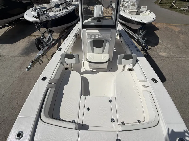 Slide: The Image of 2026 Robalo 246 Cayman boat interior, white seating and deck. - 12
