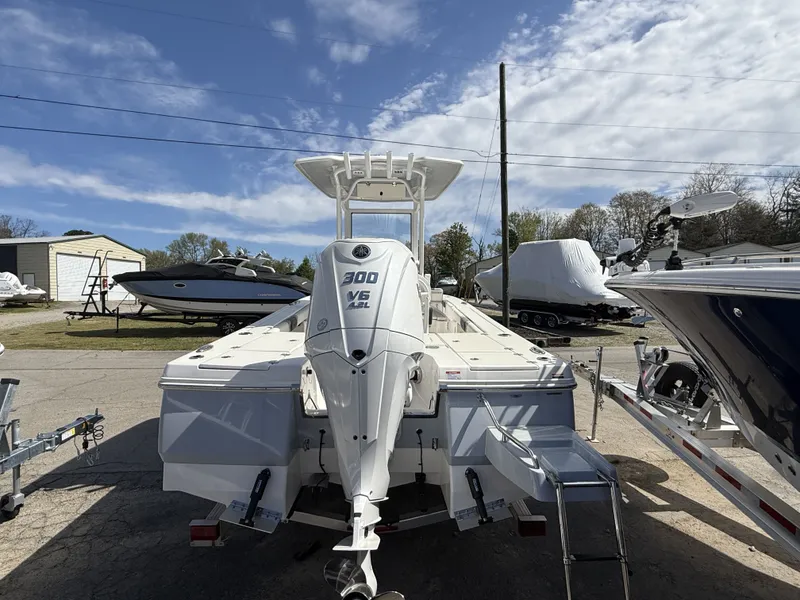 Slide: The Image of 2026 Robalo 246 Cayman with 300 HP V6 engine on a lot. - 3