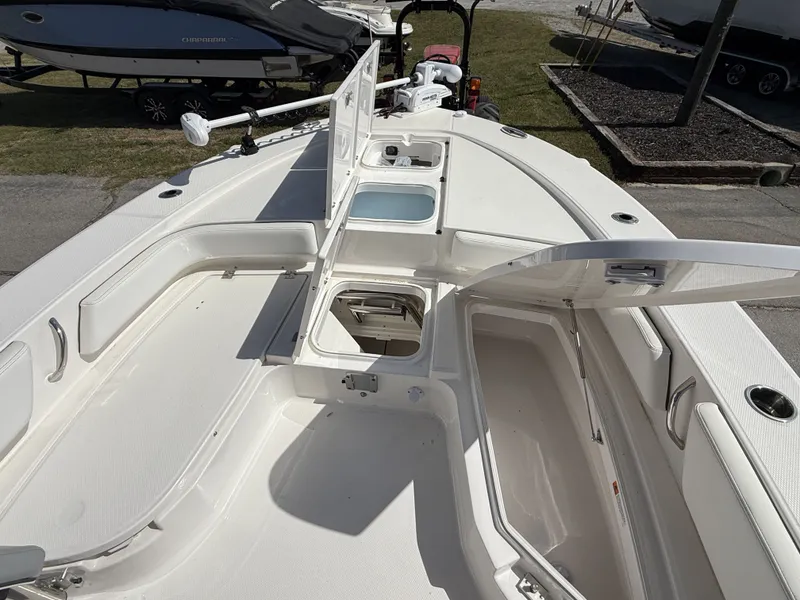 Slide: The Image of Interior view of 2026 Robalo 246 Cayman boat deck with storage compartments. - 4