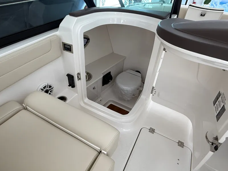 Slide: The Image of Interior of 2026 Robalo 257 Dual Console with toilet. - 10
