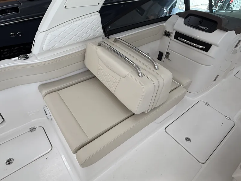Slide: The Image of Interior of 2026 Robalo 257 Dual Console with beige leather seating. - 11