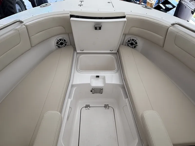 Slide: The Image of Interior of 2026 Robalo 257 Dual Console with storage compartment. - 6