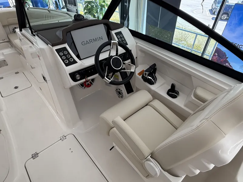 Slide: The Image of Interior view of 2026 Robalo 257 Dual Console boat with Garmin controls. - 7
