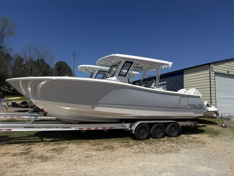 Slide: The Image of 2026 Robalo R300 Center Console on trailer, side view. - 2