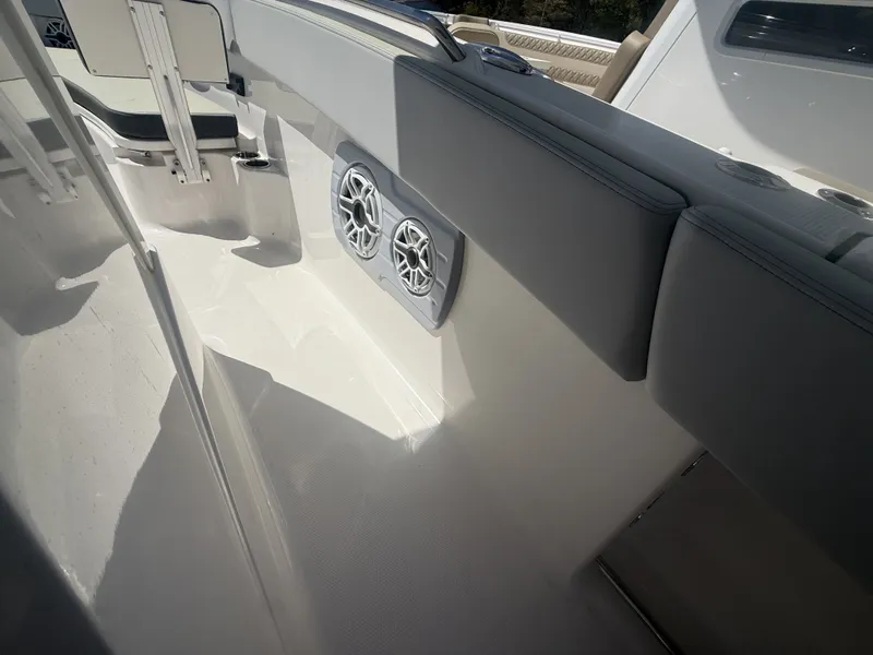 Slide: The Image of Interior of 2026 Robalo R300 Center Console with speakers. - 8