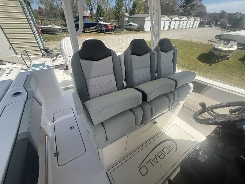 Slide: The Image of Interior of 2026 Robalo R300 Center Console with gray seating. - 9