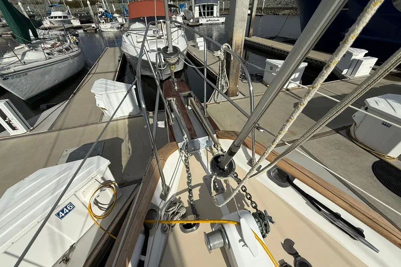 Slide: The Image of Cabo Rico Cutter 45 sailboat docked at marina, showcasing deck and rigging, year 2000 model. - 10