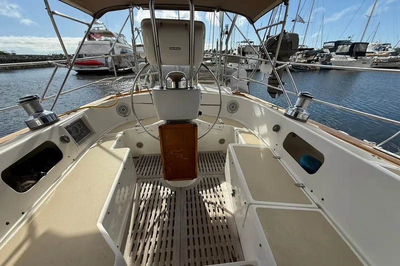 Slide: The Image of Cabo Rico Cutter 45 sailboat cockpit, 2000 model, docked in a marina. - 14