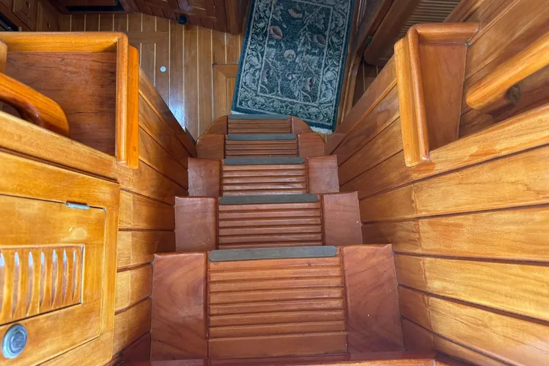 Slide: The Image of Wooden interior stairs of a 2000 Cabo Rico Cutter 45 yacht. - 18