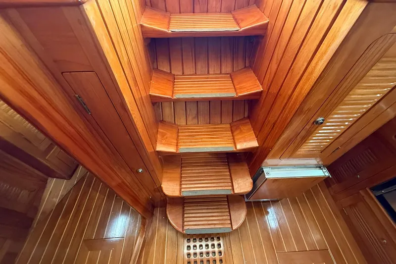 Slide: The Image of Wooden interior stairs of a 2000 Cabo Rico Cutter 45 sailboat. - 19