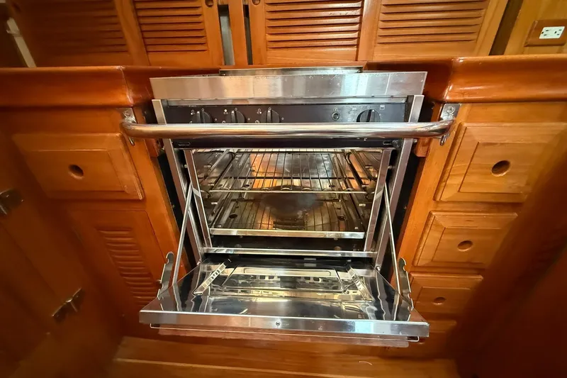 Slide: The Image of Stainless steel oven in 2000 Cabo Rico Cutter 45 yacht galley. - 23