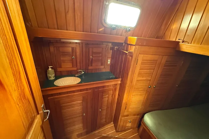Slide: The Image of Luxurious wooden interior of 2000 Cabo Rico Cutter 45 yacht bathroom. - 32