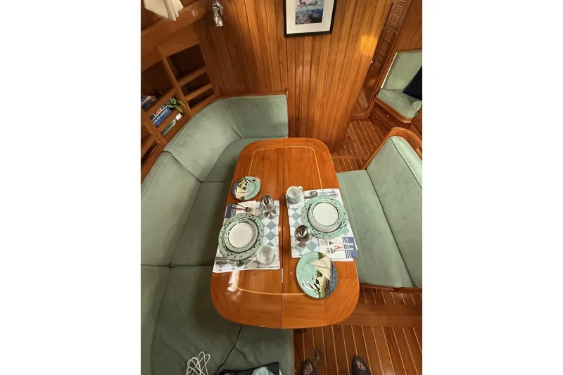 Slide: The Image of Cabo Rico Cutter 45 (2000) interior dining area with elegant table setting. - 39