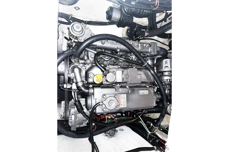 Slide: The Image of Engine of a 2000 Cabo Rico Cutter 45 sailboat, showcasing intricate mechanical components. - 40