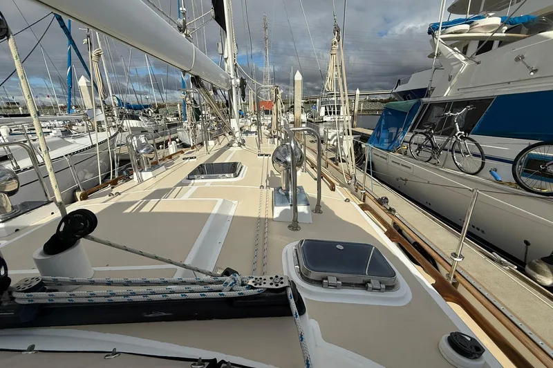 Slide: The Image of Cabo Rico Cutter 45 sailboat deck, 2000 model, docked with clear skies. - 7