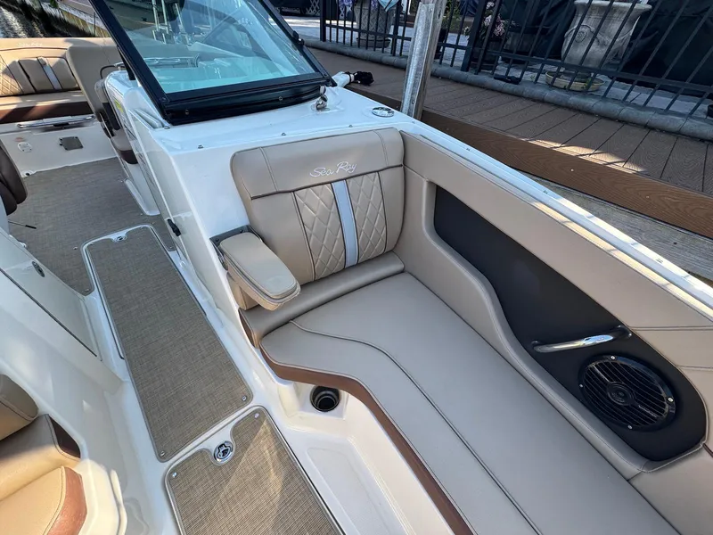 Slide: The Image of 2017 Sea Ray SDX 240 boat interior with beige seating and modern design. - 18