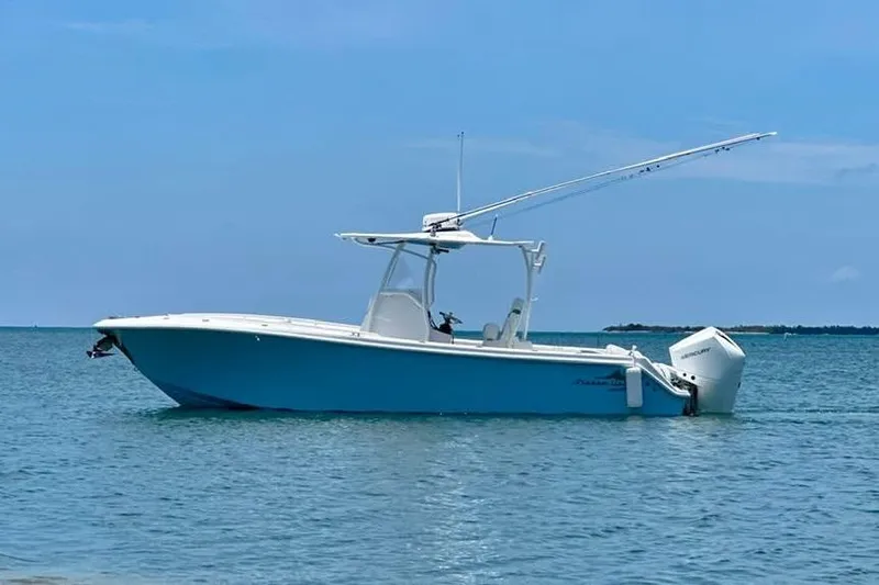 The Image of 2022 Streamline 26 boat on calm blue water under clear sky. - 0