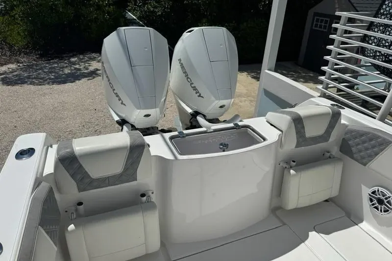 Slide: The Image of 2022 Streamline 26 boat with dual Mercury outboard engines and cushioned seating. - 4