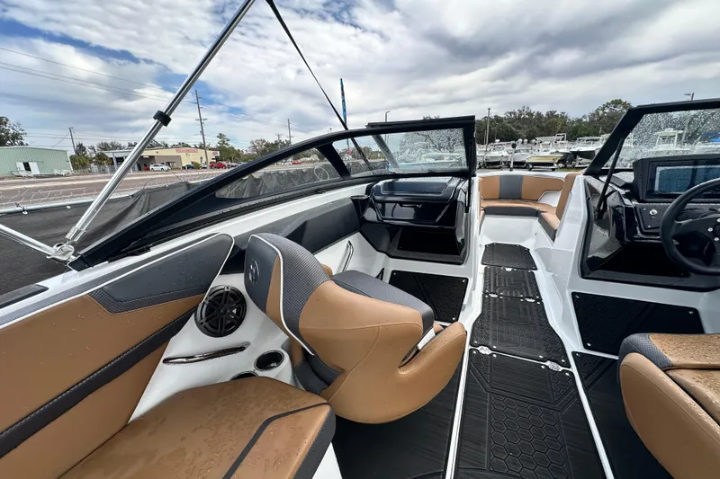 Slide: The Image of 2023 Scarab 215 ID boat interior with modern seating and dashboard design. - 20
