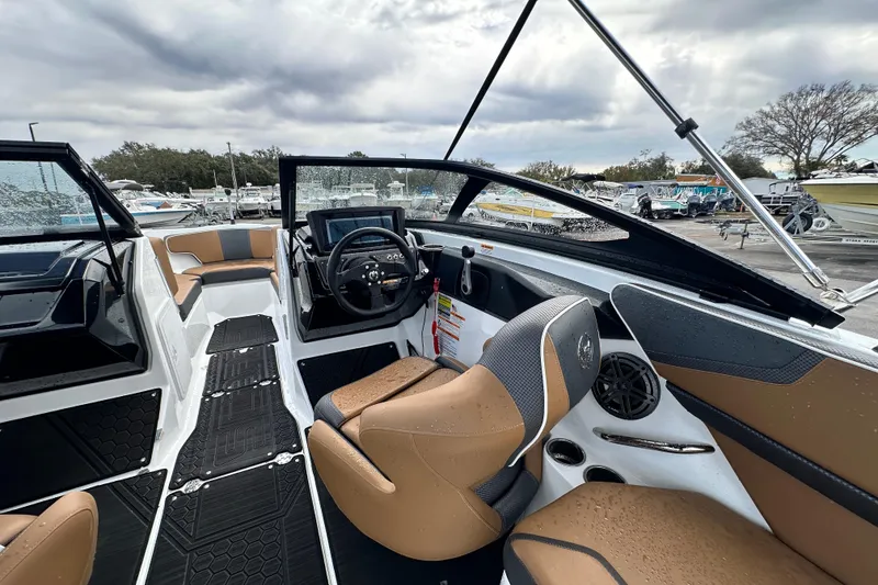 Slide: The Image of 2023 Scarab 215 ID boat interior with sleek design and modern dashboard. - 21