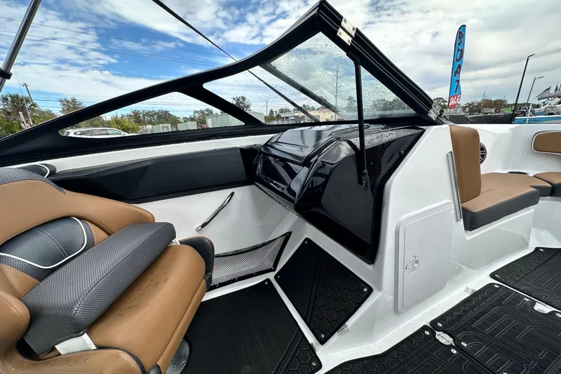 Slide: The Image of 2023 Scarab 215 ID boat interior with modern seating and dashboard design. - 30