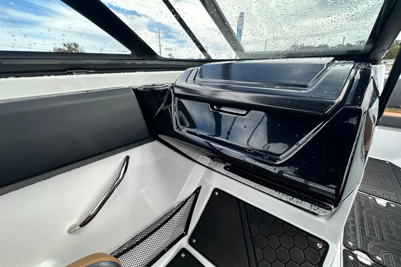 Slide: The Image of Interior of 2023 Scarab 215 ID boat with sleek dashboard and modern design. - 31