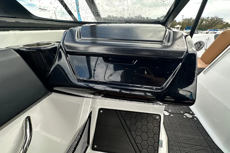Slide: The Image of 2023 Scarab 215 ID boat interior with sleek dashboard and modern design elements. - 32