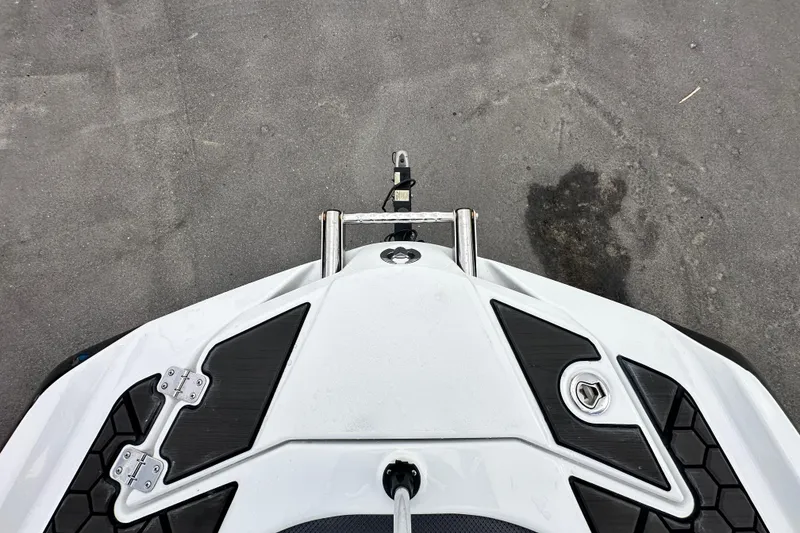 Slide: The Image of Top view of 2023 Scarab 215 ID boat's bow with sleek design and black accents. - 40