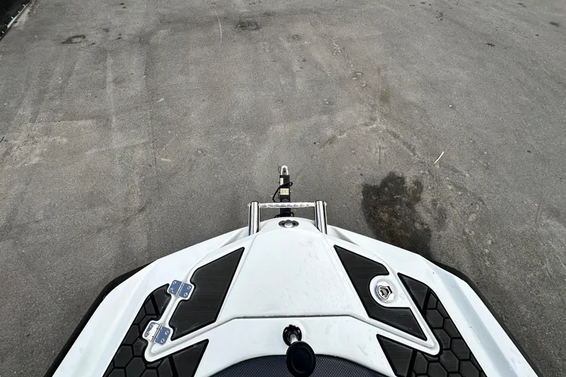 Slide: The Image of 2023 Scarab 215 ID boat on pavement, showcasing sleek design and modern features. - 41