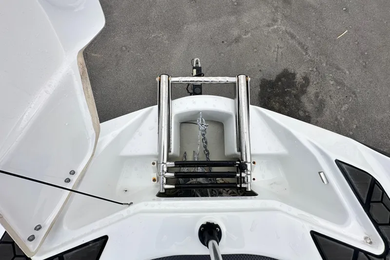 Slide: The Image of 2023 Scarab 215 ID boat with a stainless steel ladder on the deck. - 43