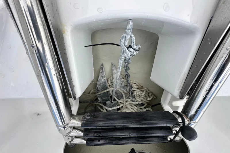 Slide: The Image of Anchor and rope storage on 2023 Scarab 215 ID boat. - 44