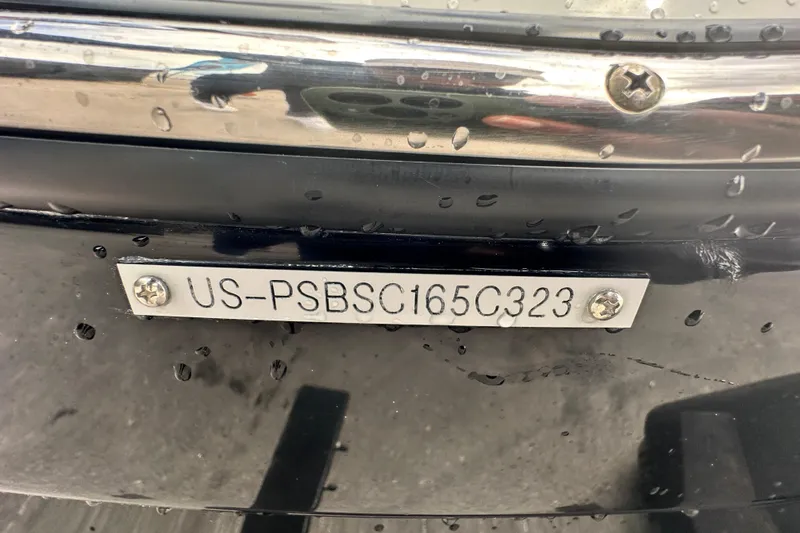 Slide: The Image of 2023 Scarab 215 ID boat with visible hull identification number plate. - 71