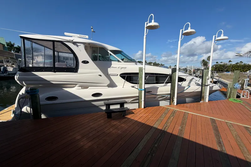 The Image of 2002 Sea Ray 480 Motor Yacht docked under clear blue sky. - 0