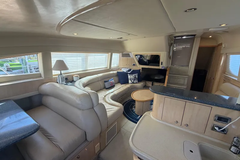 Slide: The Image of Luxurious interior of a 2002 Sea Ray 480 Motor Yacht with plush seating and modern amenities. - 19