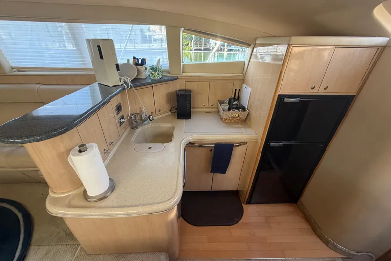 Slide: The Image of Luxurious 2002 Sea Ray 480 Motor Yacht kitchen with modern amenities and sleek design. - 21