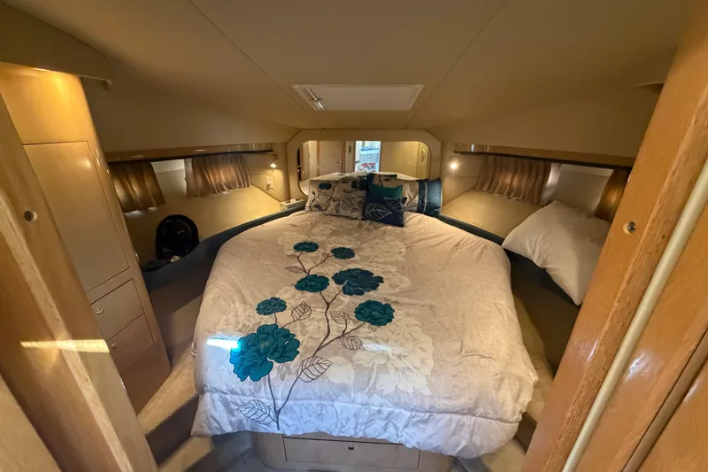 Slide: The Image of Luxurious bedroom interior of 2002 Sea Ray 480 Motor Yacht with floral bedding. - 24