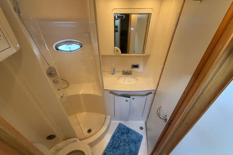 Slide: The Image of Bathroom interior of 2002 Sea Ray 480 Motor Yacht with shower and vanity. - 26